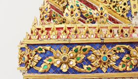 Golden Curved Wall of the Temple in Thailand